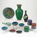 Cloisonne twelve pieces early 20th c bronze vaze with green dragon on blue ground three cylindrical boxes etc tallest 10