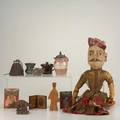 Box lot approx thirty pieces folk art carved woodfist cane two miniature south american paintings middle eastern puppet etc longest 36