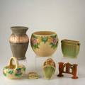 Roseville seven pieces donatello tall vase in rare glaze wall pocket frog carnelian pillow vase florane double bud gate rozane jardiniere and basket some marked tallest 11 12