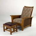 Stickley by audi contemporary droparm morris chair and ottoman with spindled sides late 20th c quartersawn oak oak veneer fabric covered back and seat cushion and vinyl ottoman brandedmetal t