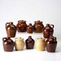 Roycroft ten glazed ceramic vessels four lidded pots and six jugs all marked largest 5 34