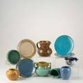 American art pottery eleven pieces fulper jug in blue flambe hampshire cabinet vase in brown matte marblehead wall pocket teco low bowl in green matte seg sugar bowl plate and vase pewabic pla
