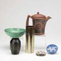American art pottery six pieces fulper vase in tan and green gunmetal clifton indianware teapot hampshire vase in matte black conestoga bowl in teal glaze and weller and haeger flower frogs all