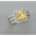 Yellow sapphire and diamond ring ca 2000 cushion shaped yellow sapphire 29 cts by formula in 14k wg rectangular setting with circular and baguette cut diamonds 108 cts tw 65 dwt 10 gs