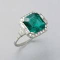Art deco 339 cts columbian emerald and diamond platinum ring octagonal step cut 1044mm x 991mm x 522mm transparent columbian origin minor oil enhancement f1 framed by baguette and circular