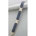 Invisibly set sapphire and diamond gold strap bracelet late 20th century rows of french cut sapphires form highly flexible panels connected by diamond links 277 sapphires approx 44 cts tw and 1