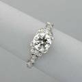 Art deco diamond platinum engagement ring round brilliant transitional cut diamond approx 125 cts in square setting and geometric openwork shoulders approx 18 ct tw 25 dwt 39 gs size