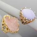 Two large freeform gold rings ca 1975 lavender jade oval cabochon 26mm x 20mm with 8 diamond accents in 14k yg rose quartz druzy in 10k yg 353 dwt gw 549 gs gw sizes 7 and 7 12