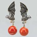 Colored diamond and coral bat earrings contemporary 18k yg and wg bats with champagne and colorless diamond wings approx 1 cts tw ruby eyes suspend 105mm coral beads 77 dwt 122 gs