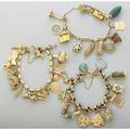 Three figural charm bracelets mid 20th century two gold and one goldfilled link bracelets suspend thirtyseven gold two gold filled and two hardstone figural charms 9 ct 10k 14k 18k 94 dwt