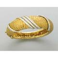 Textured 18k gold and diamond hinged bracelet ca 1965 fish scale textured yellow gold and ribbons of circular brilliant cut diamonds in white gold approx 316 cts tw 501 dwt 779 gs taper
