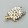 Tiffany  co pearl and diamond turtle brooch france mid 20th century 18k yg bombe body paved with pearls separated by diamonds diamond feet and head with sapphire eyes hinged double pin 87 dw
