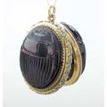 Tiffany  co massive jeweled egyptian revival pendant ca 1890 two scarab carved garnet carbuncles oppose to form a locket 18k hinged frame with green champleve enamel scroll and omc diamonds in p