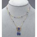 Egyptian revival diamond lapis gold lavalier ca 1925 lapis pharoah cameo on 18k and rose cut diamond panel suspends two lapis amphora 14k fetter link swag chain with seed pearls and lapis beads 7