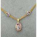 Enameled gold putti slide and locket necklace ca 1880 double chain with oval slides and locket of pink guilloche enamel grounds depicting putti with floral obverses apparently unmarked 148 dwt
