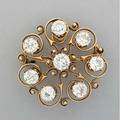 Diamond and gold scroll brooch ca18801900 attrib to herpers brothers newark 8 bright oec diamonds approx 36 cts tw in f herpers patented diamond settings on knifeedged scrolls 18k yg h
