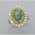Black opal diamond demantoid garnet ring ca 1910 oval cluster in colors of a peacock feather oec diamonds approx 1 cts tw surround a row of bright green garnets and black opal 36 dwt 55