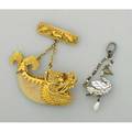 Two figural victorian pendants raj era tiger claw in chinese 18k filigree dolphin mount suspends from an american 14k sea life motif pin continental renaissance revival enameled silver and pearl swan
