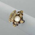 Renaissance revival enameled gold diamond pearl ring paris 18401879 designed as postset spherical pearl among enameled scroll and crown with rose cut diamond accents unidentified maker db abo