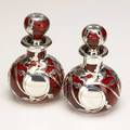 Pair of cranberry glass perfume bottles with silver overlay 20th c 5 12
