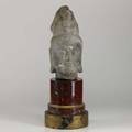 Chinese buddha head carved limestone likeness of avalokiteshvara on red marble base 19th20th c 25 with base