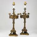 Pair of bronze gothic candelabra gryphon feet and cabochon paste highlights 20th c electrified 26 12 x 7