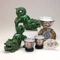Asian pottery and porcelain seven pieces include pair of green foo dogs pair of imari teacups etc 19th20th c tallest 7 12