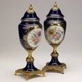 Pair of porcelain urns dore bronze mounted with floral decoration 20th c 16 12 x 5
