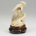 Chinese ivory carving bird on a stump surrounding a trapped animal on wood stand 20th c 6 14 x 4 12