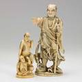 Two japanese ivory figures gentleman with serpent coiled around his leg and figural group early 20th c missing hands to both taller 10 12