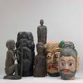 African carvings six items 20th c four fullstanding figures and two polychrome carved heads largest 15 34