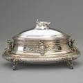 Tiffany  co figural silver jewelry casket 18541869 oval hinged box on four lion mask feet recumbent nudes flank cartouche each side with reclining young girls holding wreaths applied as handles