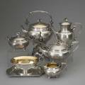 Christofle chinese coffee service and sauce boat 18621885 french silverplated service with gilt rosettes floral panels and palmette bands on engine turned ground lily blossom finials and ivory