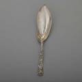 Tiffany  co grapevine silver ice cream server ca 1890 meandering vines and foliage lap over edge ribbon monograms on handle reverse 506 ot 12 34