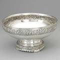 Tiffany  co olympian pattern centerpiece bowl ca 1883 broad bowl with fanciful frieze of cherubs among grape arbors elaborate foliate and scroll foot 7816 12 pints 56 ot 12 12 x 7 12