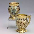 Tiffany  co mackay silver gilt and enamel coffee cups two cups from the mackay service tiffany  co 1878 barrel forms decorated in the indian manner with shaped feet and foliate chased handles