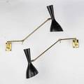 Stilnovopair of articulated wall sconces italy 1950sbrass enameled aluminumunmarkedeach fully extended 26shade diameter 5
