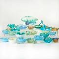 Murano glassthirtyone pieces mostly ashtrays in blue and teal glass with cased gold foilunmarkedlargest 5 x 13