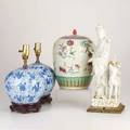 Asian porcelainfour pieces 19th20th c blanc de chine quan yin with deer mounted on lamp base pair of blue ginger jars converted to lamps and ginger jar incised with floral decorationtallest 17