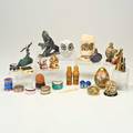 Cabinet grouptwentyseven pieces 19th20th c including orient and flume paperweight scrimshaw of wooly mammoth malachite and silver statue of seagull etcsome markedtallest 5