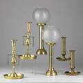 Brass candlesticksix pieces 20th c pair with bells attached pair adjustable sticks and pair with ball shadestallest 15 14
