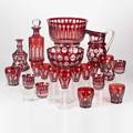 Ruby cut to clear glasstwentyone pieces 20th c mostly hungarian leaded crystal including large punch bowl with four cups six white wine glasses etcmost with original labelstallest 8