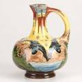 Brantjes purmerendearthenware jug with cranes and butterflies netherlands c 1900obscured faience de purmerend marks9 x 8 x 7
