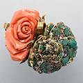 Massive coral and jeweled cuff iradj moini hinged cuff of gilt metal designed as a pair of roses one deeply carved coral one a jeweled openwork of emeralds amethyst citrine pastes coral accent