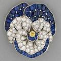 Oscar heyman sapphire and diamond pansy brooch retailed by udall and ballou ca 1935 mysteryset fancy baguette cut blue sapphires approx 625 cts tw with fancy yellow diamond approx 16 ct a
