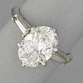 Platinum oval diamond engagement ring oval brilliant cut diamond 112 x 79 x 503 mm 275 cts by formula and two tapered baguette cut diamonds 75 mm in platinum setting 3538 38 dwt 59
