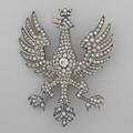 Diamond heraldic crowned eagle brooch orzel bialy white eagle the national coat of arms poland silvertopped gold with gold highlights set with oec diamond approx 60 ct ruby eye detachable