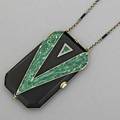 Art deco enameled 14k gold necessary ca 1922 rectangular canted form with green malachite enamel on black enameled ground platinum diamond ornament and thumb press two hinged compartments with