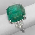 Emerald and diamond sugarloaf ring emerald cabochon approx 195 cts and baguette cut diamond shoulders approx 90 cts tw in 14k wg with fingerlock expandable shank ca 1955 65 dwt 103
