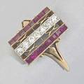 Art deco diamond and ruby ring designed as an open filigree with channels of square rubies in 14k yg separated by a row of diamonds in platinum ca 1925 14 dwt 22 gs size 4 34